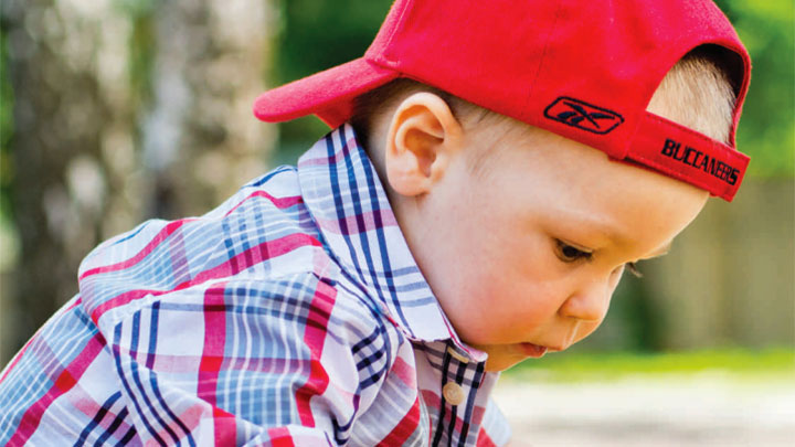 photo of young child in red hat